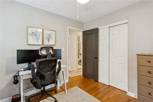 a workspace with wooden floor and a cabinet