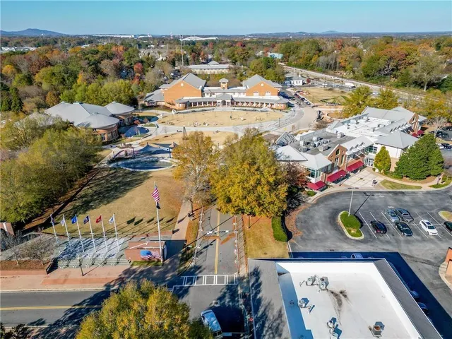 an aerial view of residential houses with outdoor space