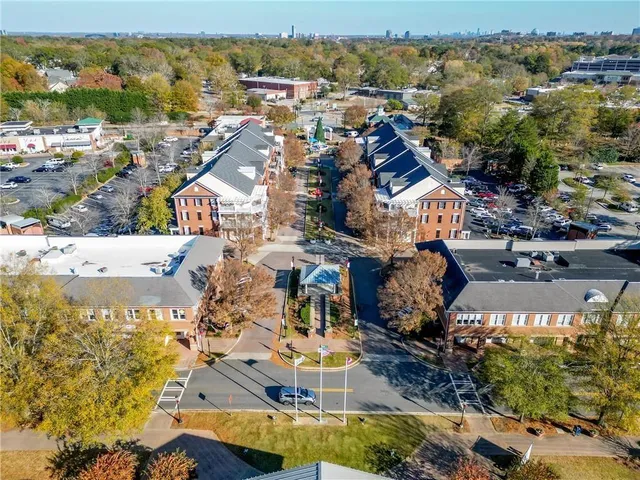 an aerial view of a houses with a lake view