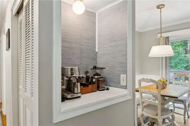 a dining room with furniture and a chandelier