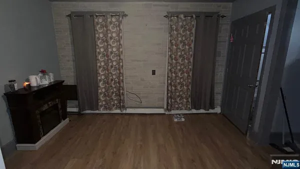 a view of a entryway door with wooden floor