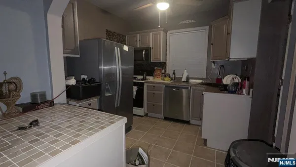 a kitchen with a sink stove and refrigerator