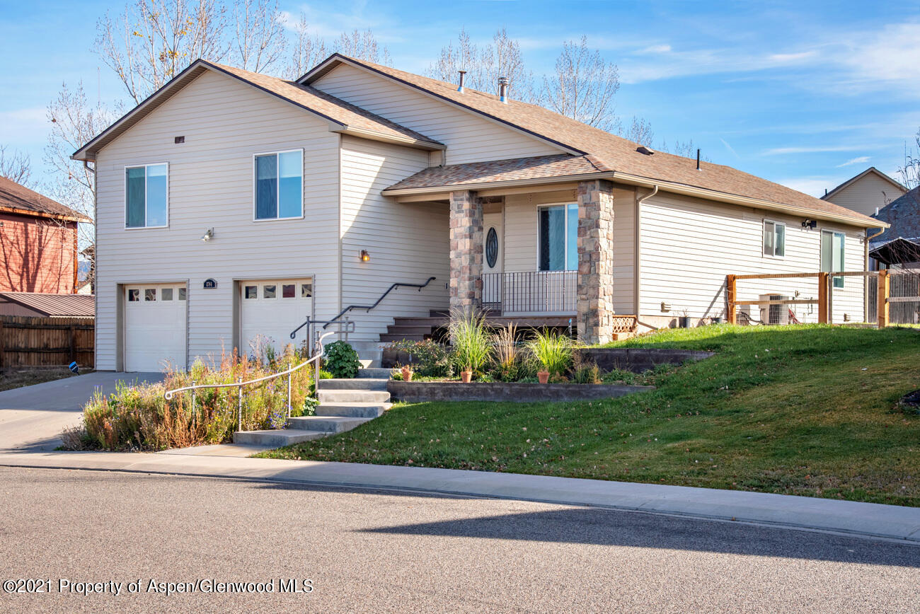1784 Anvil View Avenue Rifle, CO 81650 - Photo 1 of 29 a front view of a house with a yard and garage