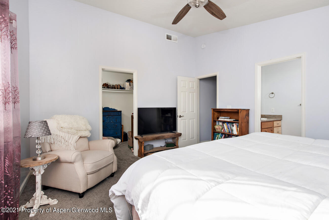 1784 Anvil View Avenue Rifle, CO 81650 - Photo 14 of 29 a bedroom with a bed and a flat screen tv