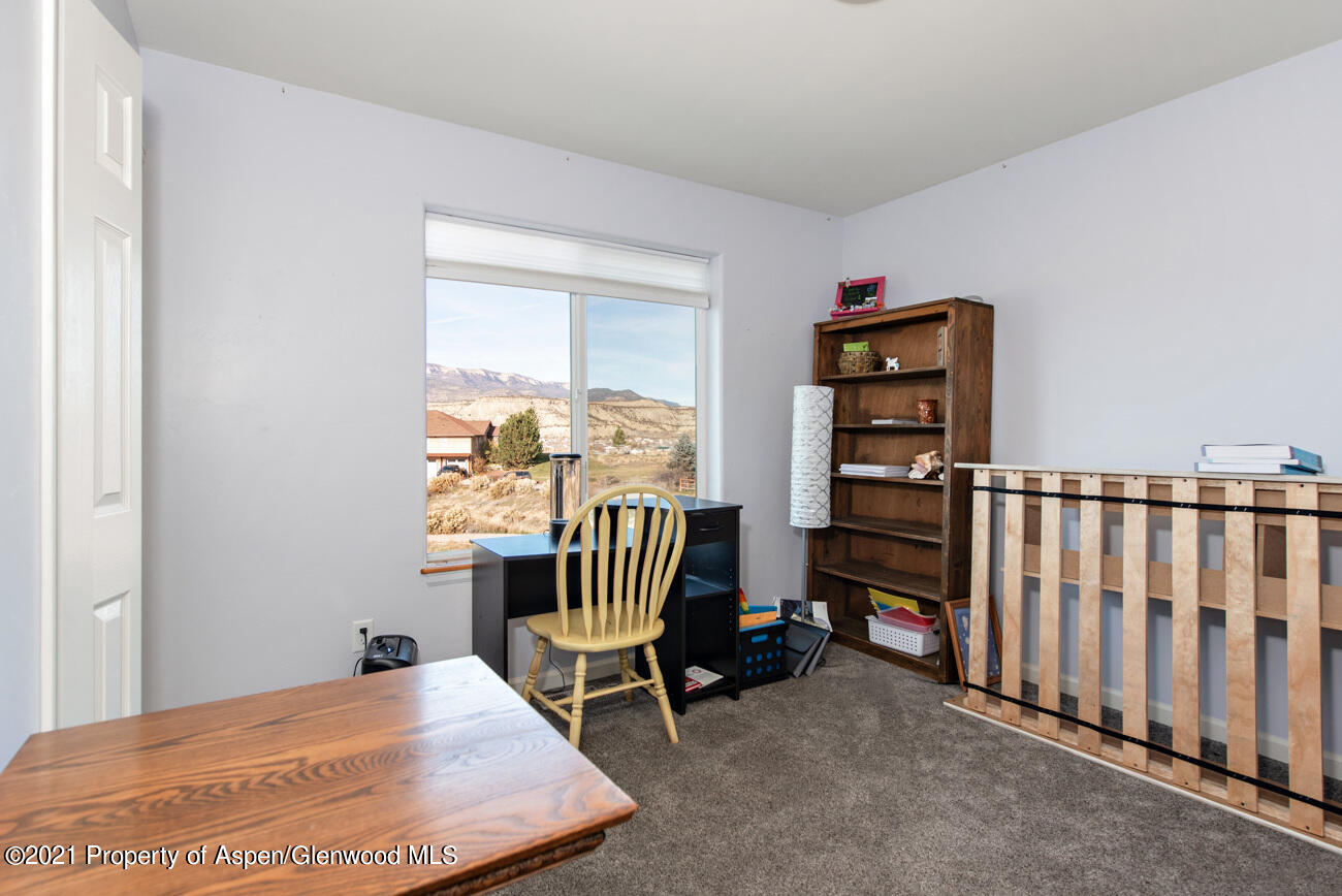 1784 Anvil View Avenue Rifle, CO 81650 - Photo 21 of 29 a room with furniture and a window