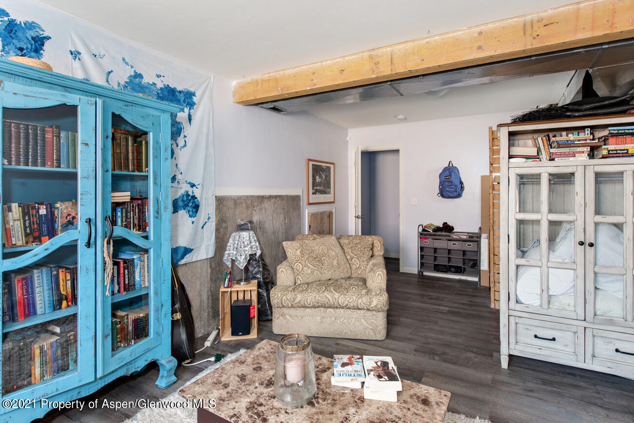 1784 Anvil View Avenue Rifle, CO 81650 - Photo 22 of 29 a living room with furniture and a book shelf