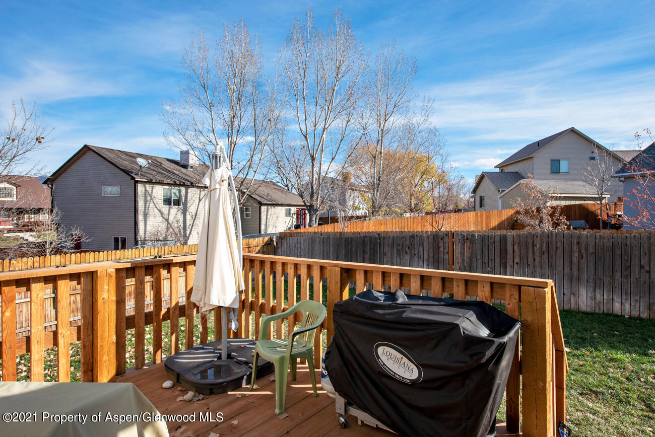 1784 Anvil View Avenue Rifle, CO 81650 - Photo 26 of 29 a view of a roof deck with couches and wooden fence