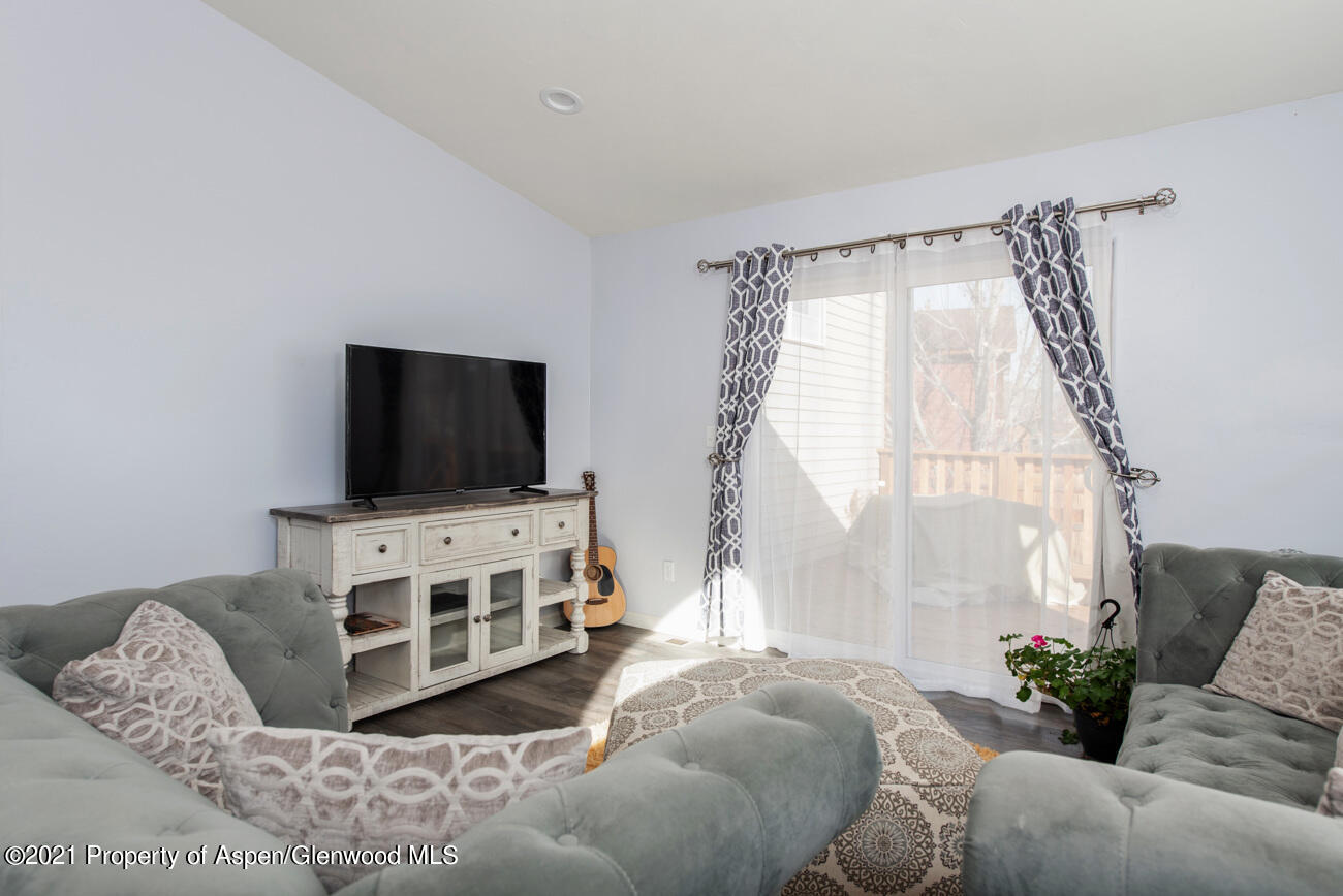 1784 Anvil View Avenue Rifle, CO 81650 - Photo 9 of 29 a living room with furniture and a flat screen tv
