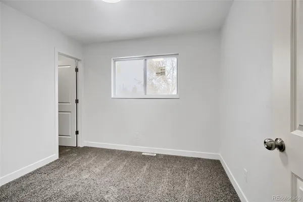 an empty room with a door