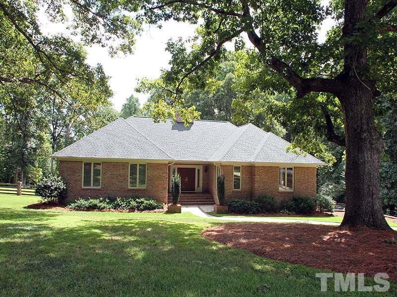 8216 Inverstone Lane Raleigh, NC 27606 - Photo 1 of 25 Fantastic landscaped brick home on wooded lot.
