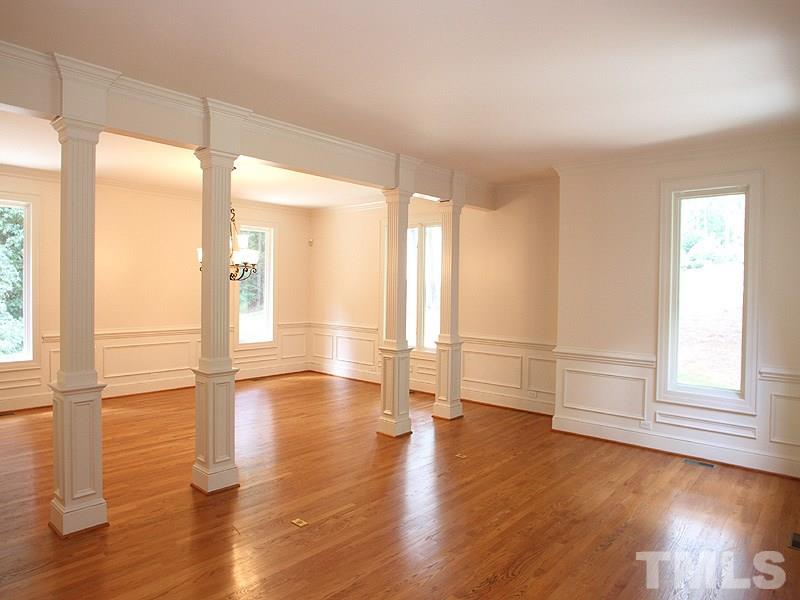 8216 Inverstone Lane Raleigh, NC 27606 - Photo 6 of 25 Open plan with gleaming hardwoods, wainscoting.