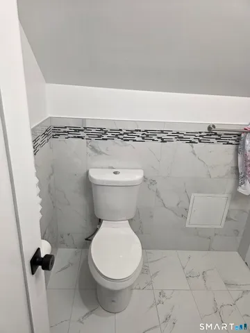 a close view of a toilet in a bathroom
