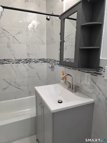 a bathroom with a sink and a bathtub