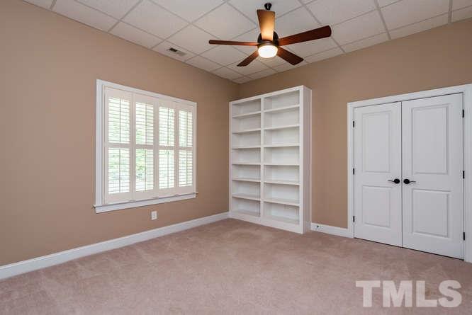 7026 Rippling Stone Lane Raleigh, NC 27612 - Photo 21 of 25 Bedroom in basement adjoins full bath.