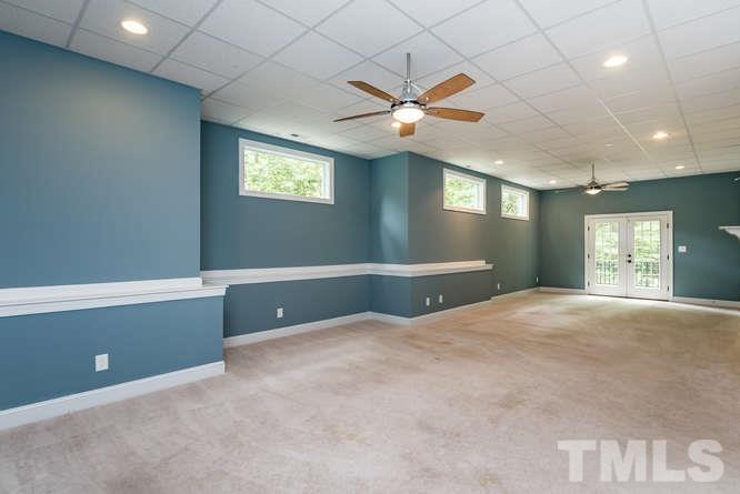 7026 Rippling Stone Lane Raleigh, NC 27612 - Photo 22 of 25 Perfect space for your exercise equipment! 2 ceiling fans and tons of natural light!