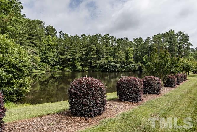 7026 Rippling Stone Lane Raleigh, NC 27612 - Photo 25 of 25 The pond across the street provides a beautiful water front view.