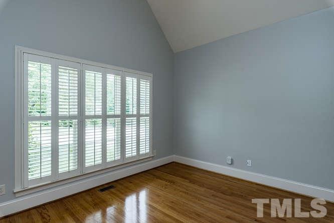 7026 Rippling Stone Lane Raleigh, NC 27612 - Photo 4 of 25 Office has a vaulted ceiling and a lovely water front view. Don't miss the custom plantation shutters throughout the home!