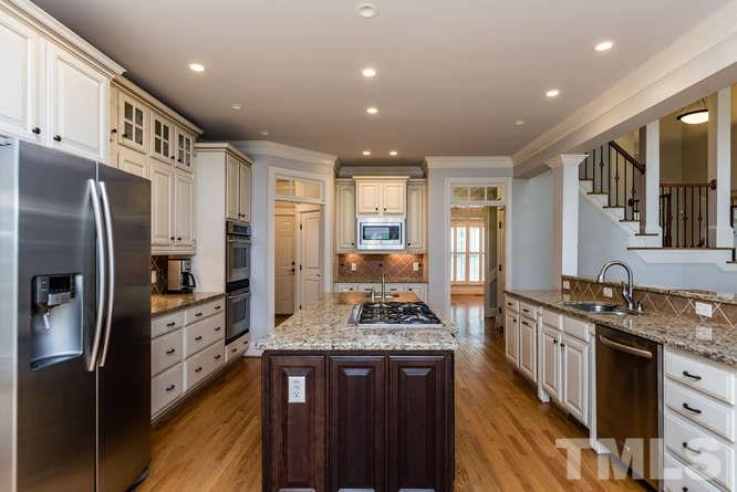 7026 Rippling Stone Lane Raleigh, NC 27612 - Photo 7 of 25 This kitchen is a chef's delight! Tons of cabinet and counter space and open to large family room and breakfast room.