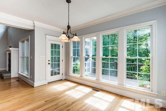 7026 Rippling Stone Lane Raleigh, NC 27612 - Photo 9 of 25 The breakfast room boasts tons of natural light and a view of the beautiful, private backyard.