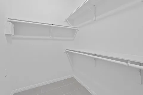 a view of an empty walk in closet