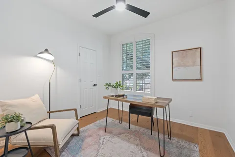 a view of a workspace with furniture