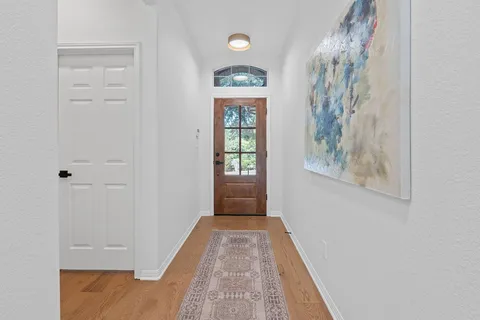 a view of a hallway with windows