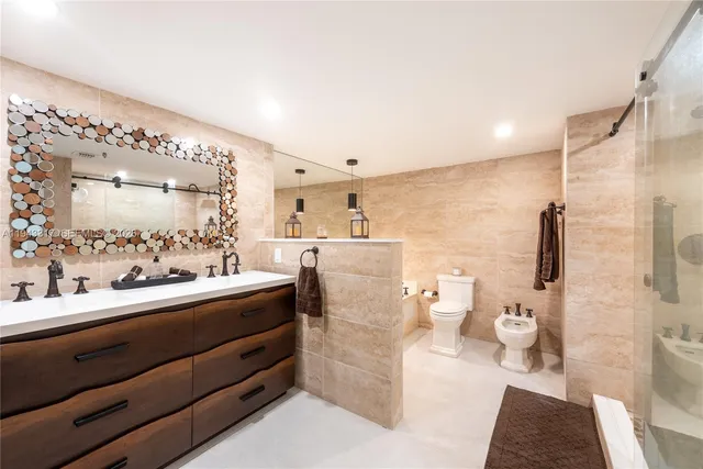 a bathroom with a double vanity sink mirror and shower