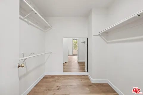 a view of a hallway view with staircase