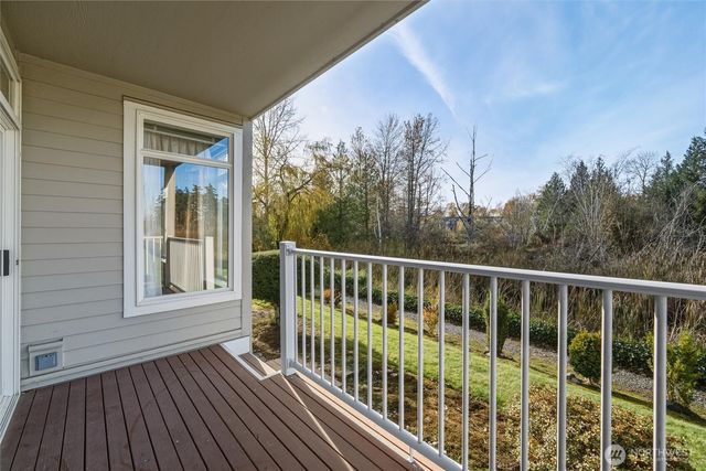 a view of a two chairs in the balcony
