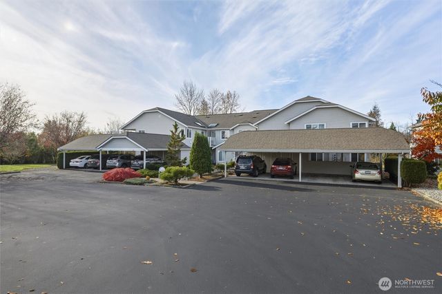 a front view of a house with garage