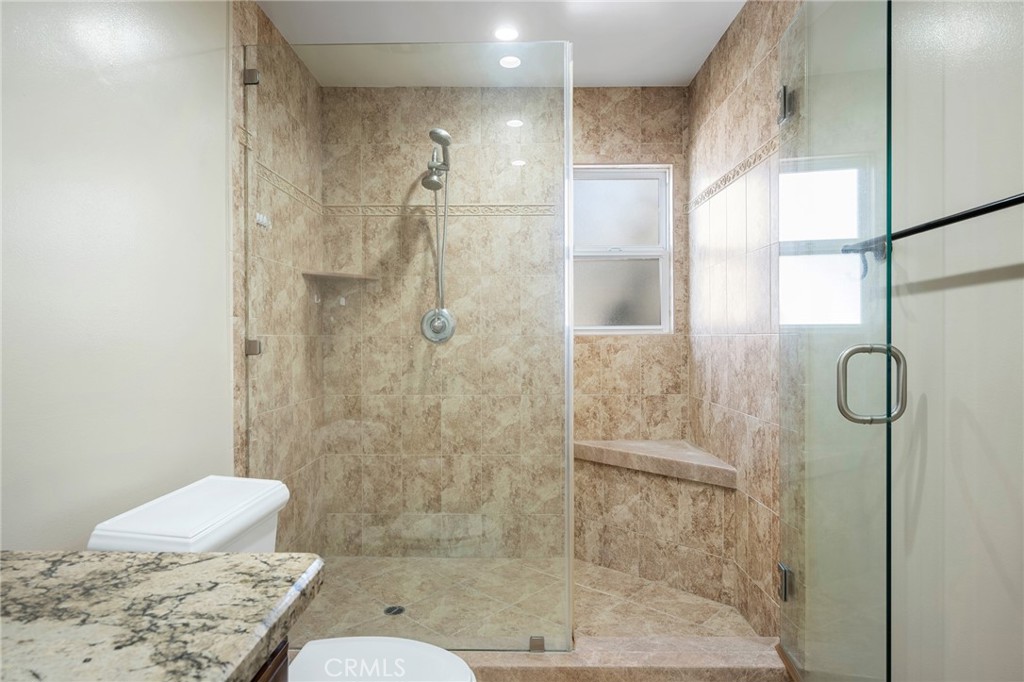 6541 Elmo Street Tujunga, CA 91042 - Photo 13 of 20 a bathroom with a shower