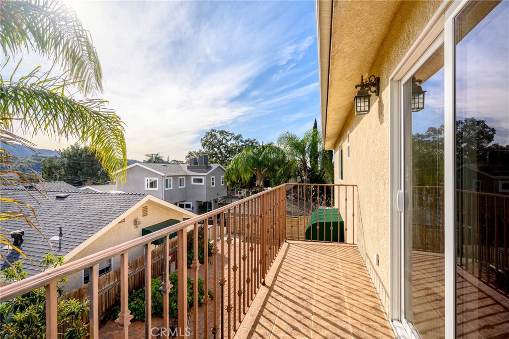 6541 Elmo Street Tujunga, CA 91042 - Photo 15 of 20 a view of a balcony with wooden floor and fence