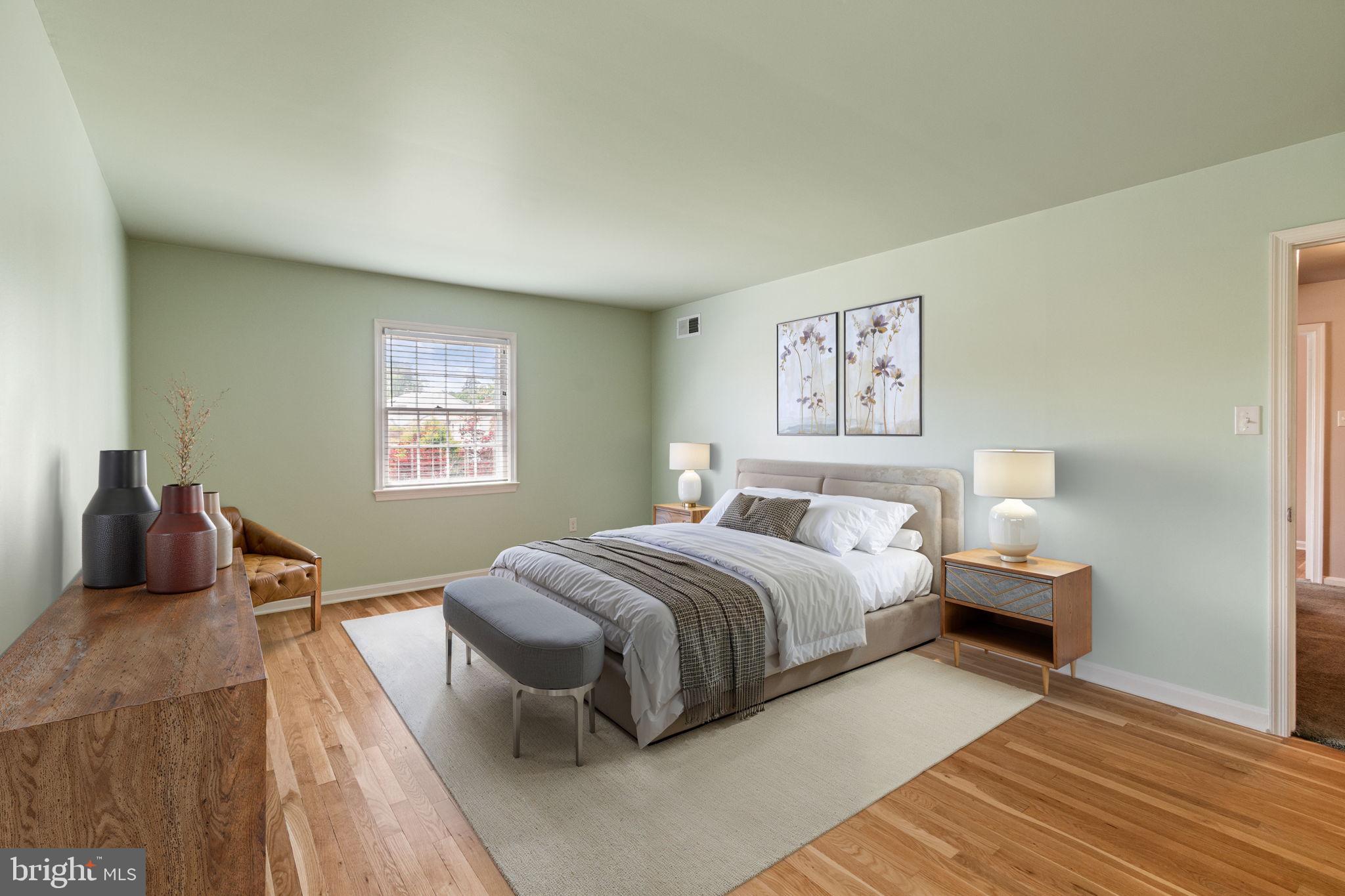 Primary bedroom  with  hardwood floors