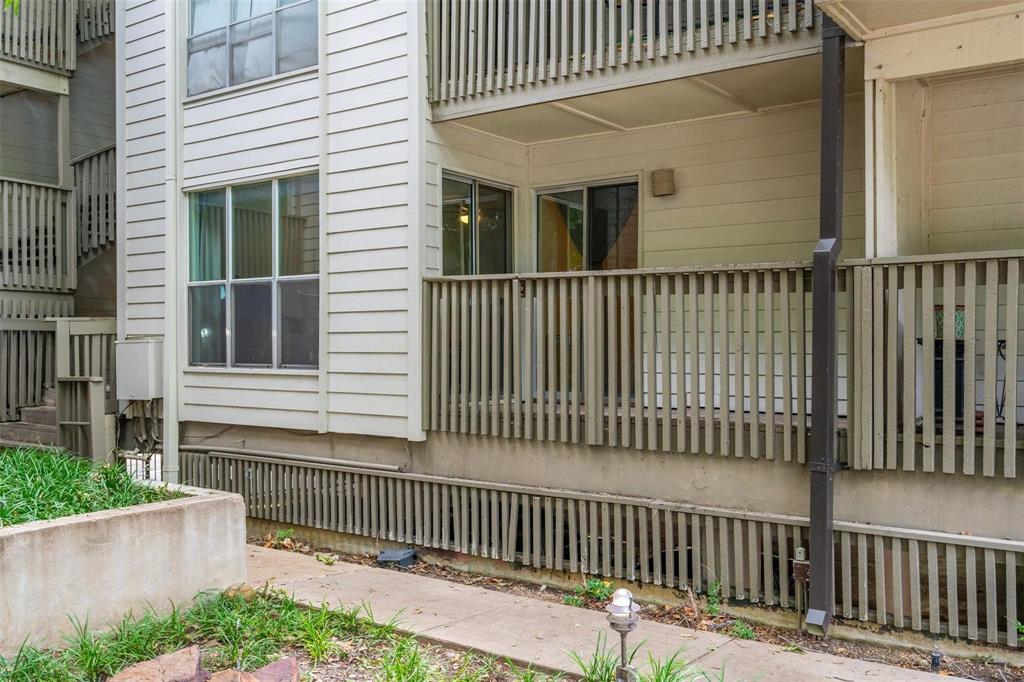 4837 Cedar Springs Road, Unit 110 Dallas, TX 75219 - Photo 19 of 21 a view of a house with a wooden fence