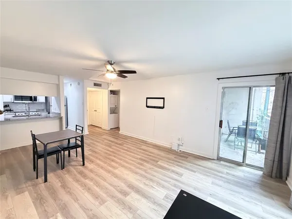 a view of a livingroom with furniture and wooden floor