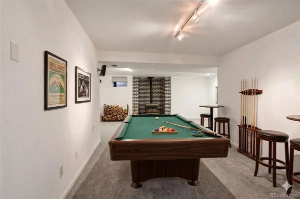 a room with furniture and a pool table