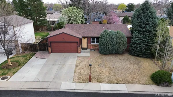an aerial view of a house with a yard