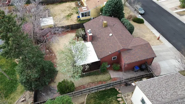an aerial view of house with a yard