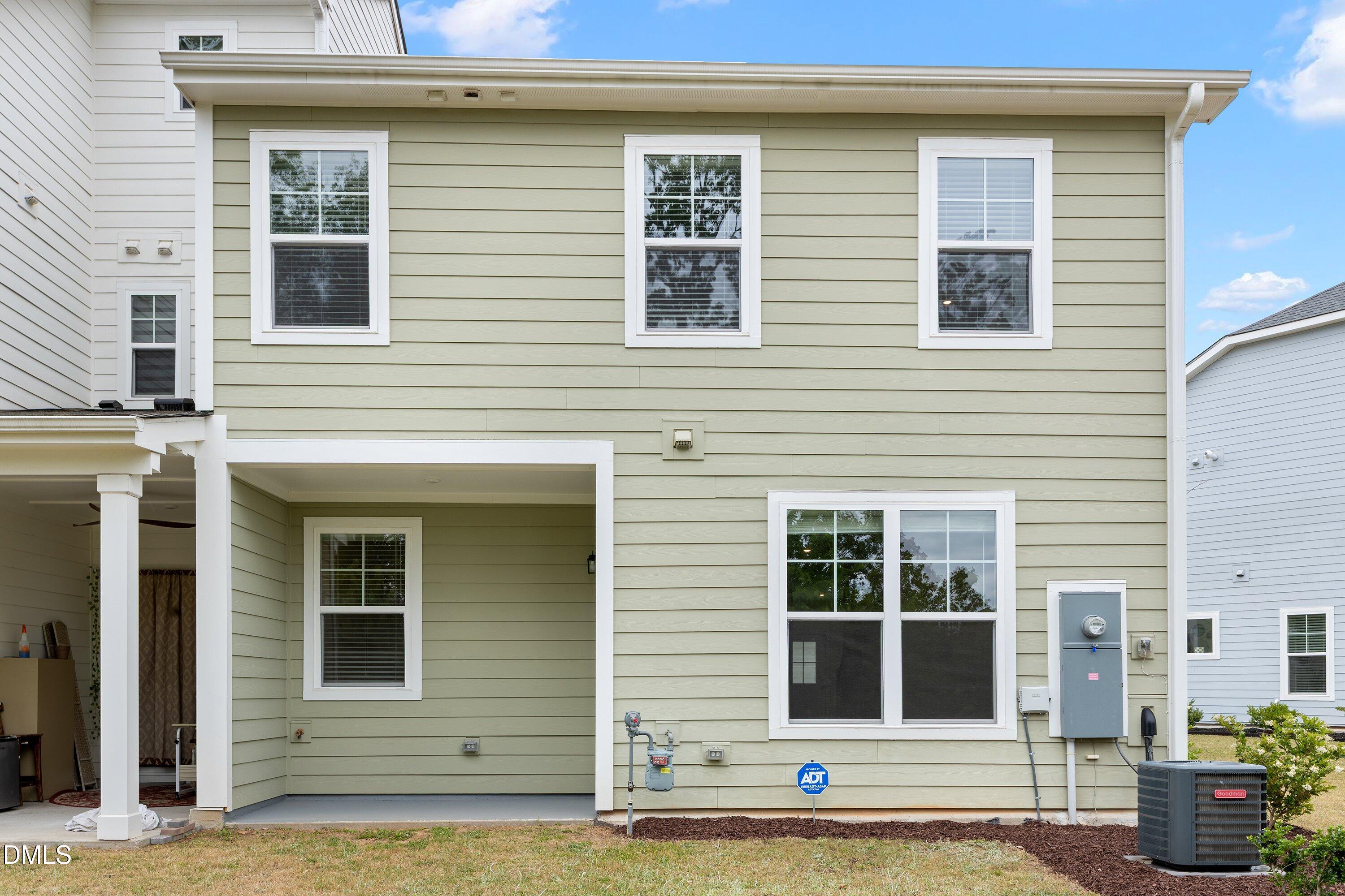 156 Sears Ridge Lane Morrisville, NC 27560 - Photo 40 of 49 a view of a brick house with many windows