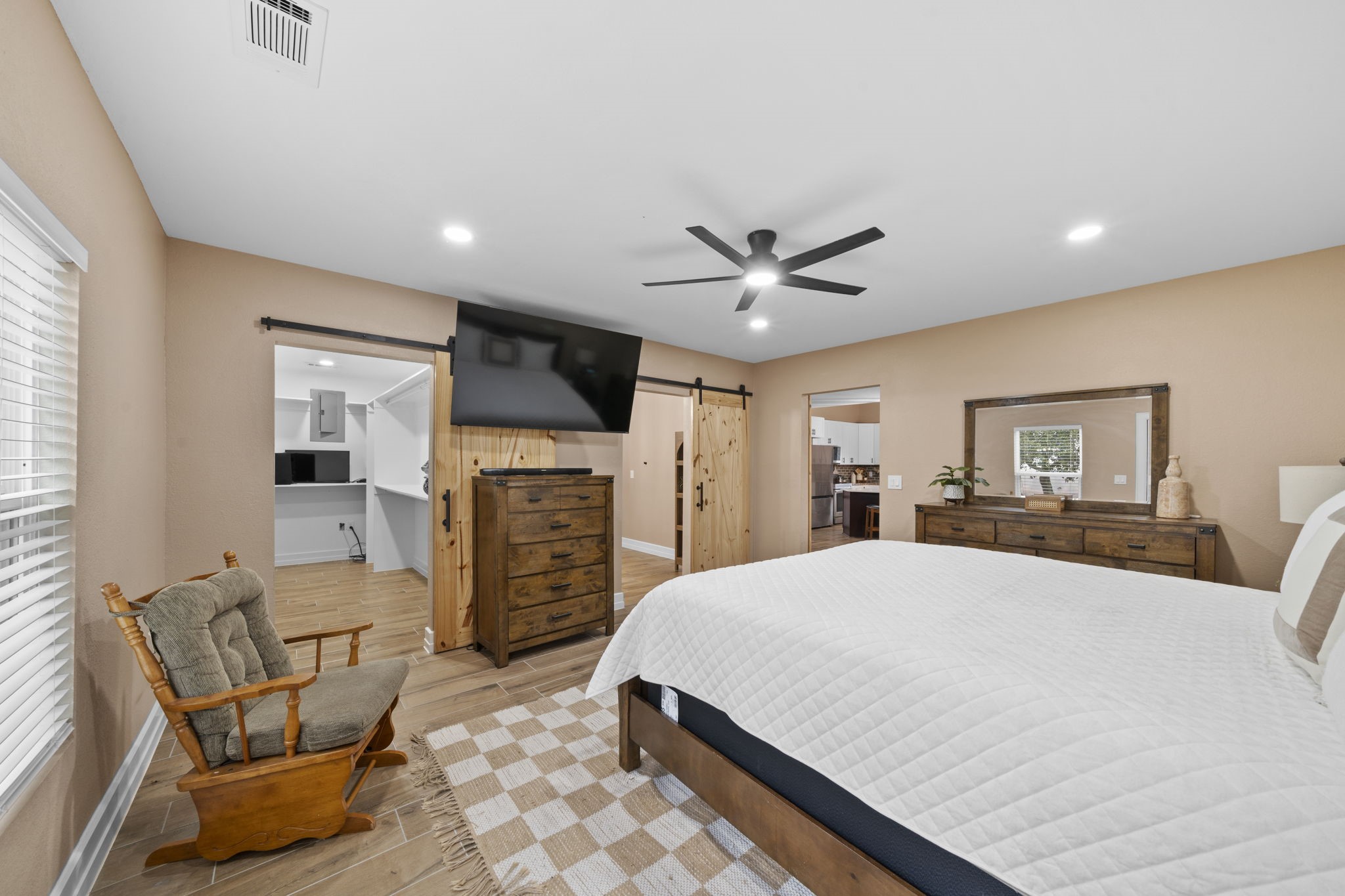 4011 County Road 219 Anderson, TX 77830 - Photo 14 of 38 a bed room with furniture and a flat screen tv