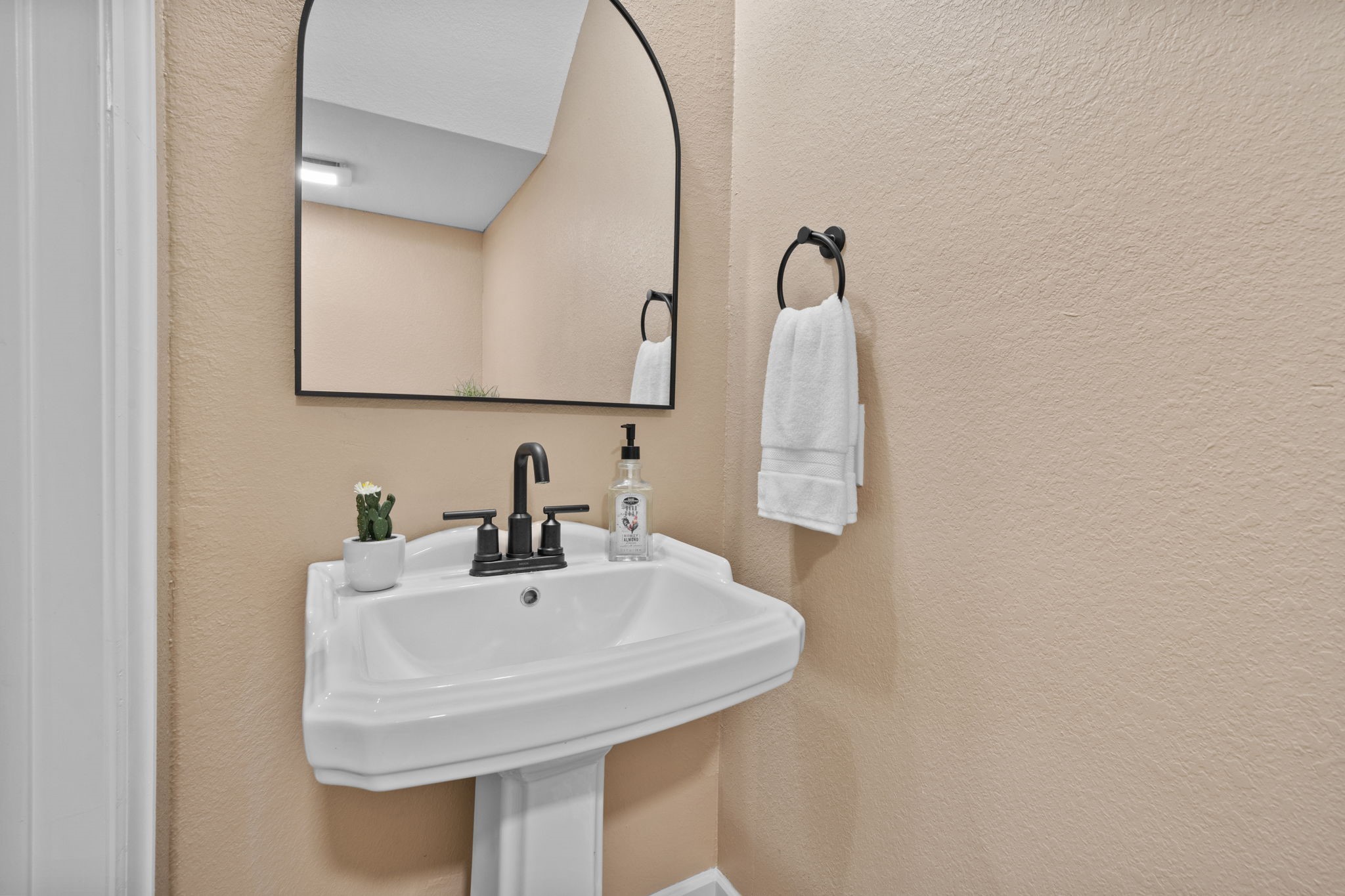 4011 County Road 219 Anderson, TX 77830 - Photo 21 of 38 a bathroom with a sink and a mirror