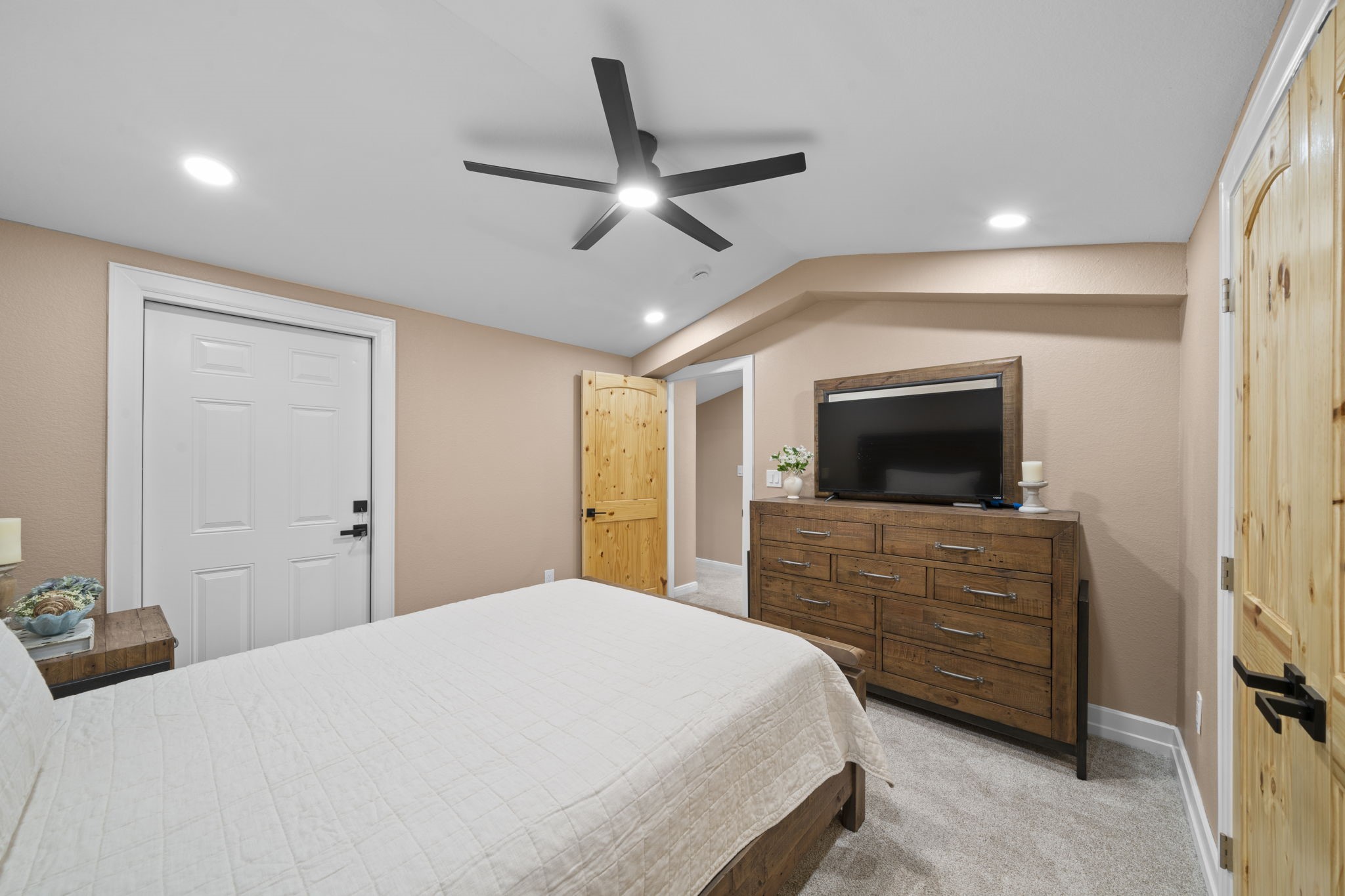 4011 County Road 219 Anderson, TX 77830 - Photo 26 of 38 a bedroom with a bed and a flat screen tv