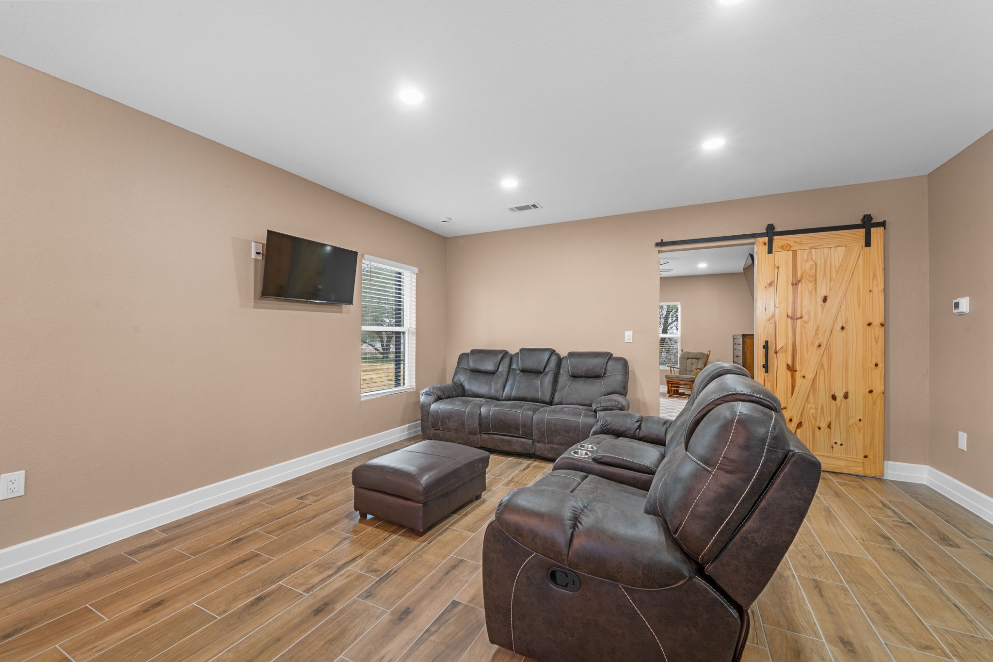 4011 County Road 219 Anderson, TX 77830 - Photo 7 of 38 a living room with furniture and a flat screen tv