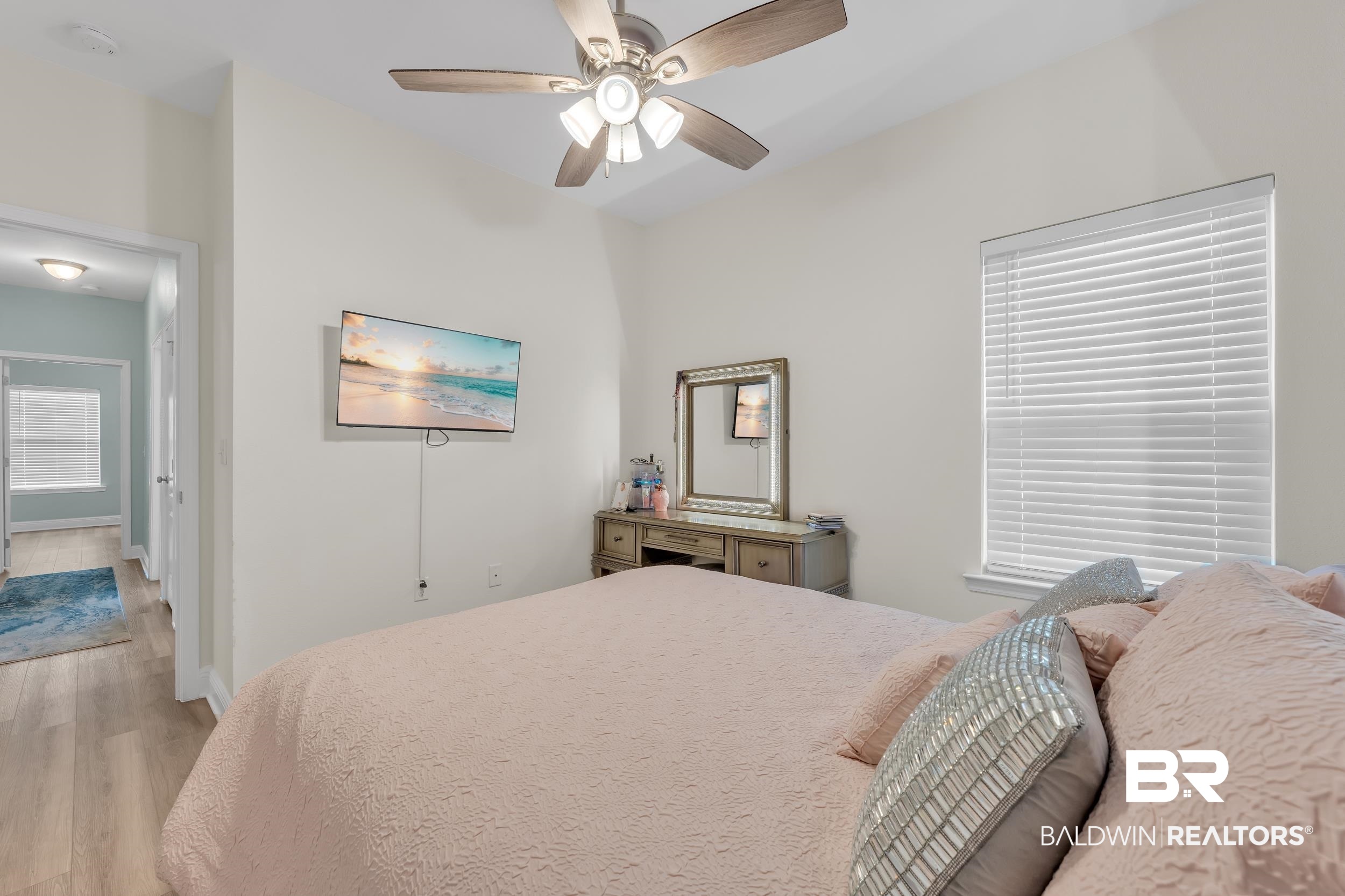 7109 Rocky Rd Loop Gulf Shores, AL 36542 - Photo 24 of 30 Bedroom with light wood finished floors, baseboards, and a ceiling fan