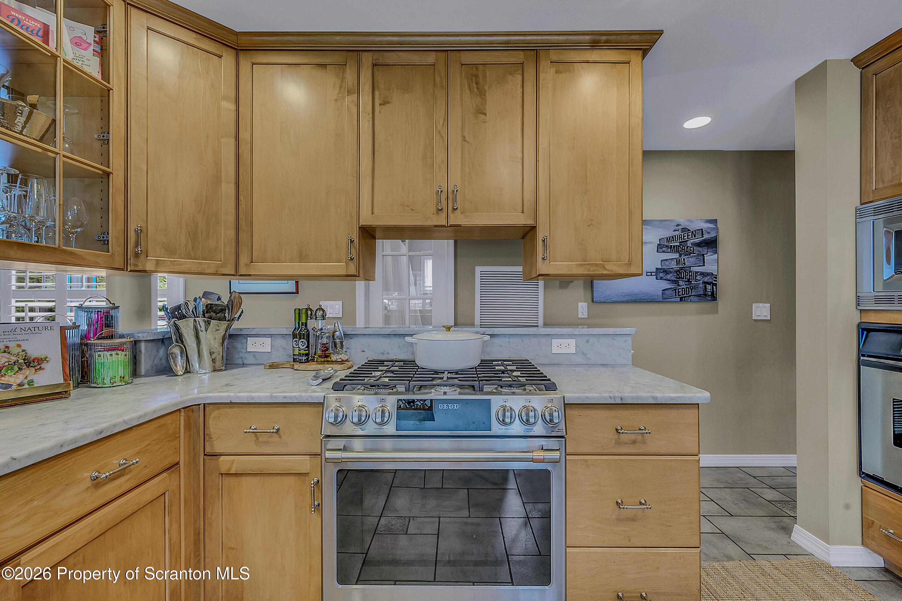 330 Glenburn Road Clarks Green, PA 18411 - Photo 32 of 69 a kitchen with granite countertop a sink a stove and cabinets