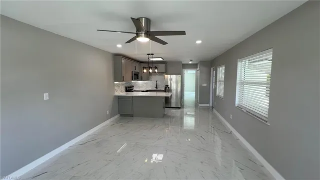 a view of a kitchen with a sink and cabinet area