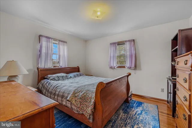 a bedroom with bed and a window