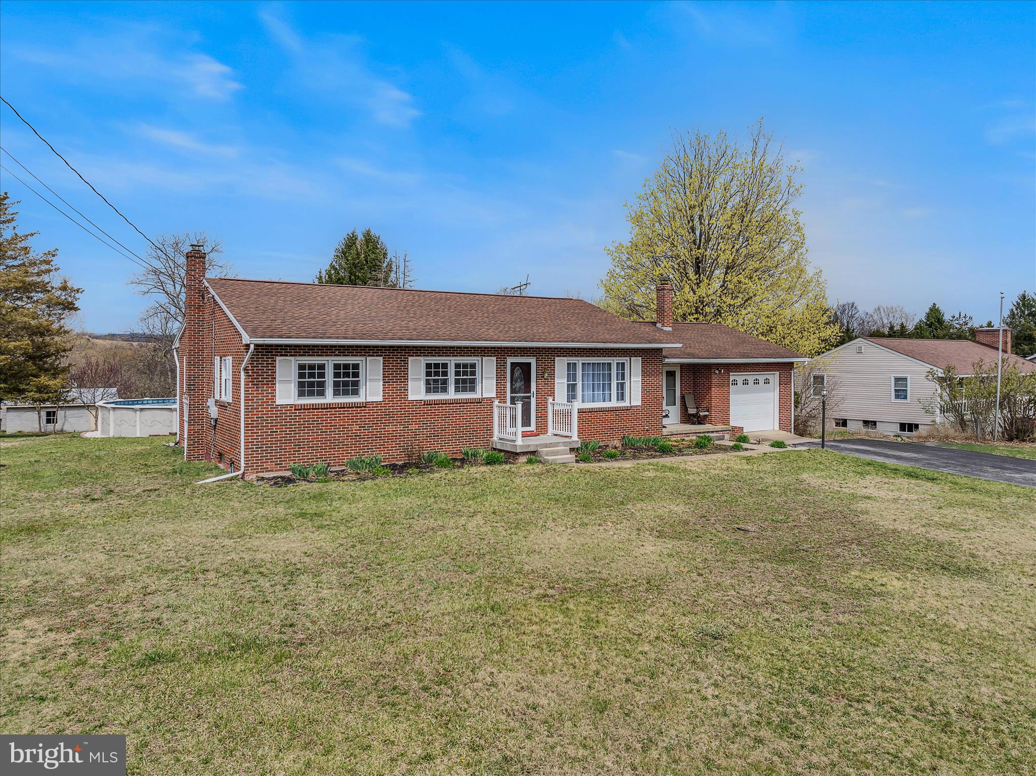1635 Fairview Drive Berkeley Springs, WV 25411 - Photo 3 of 45 a front view of a house with a garden