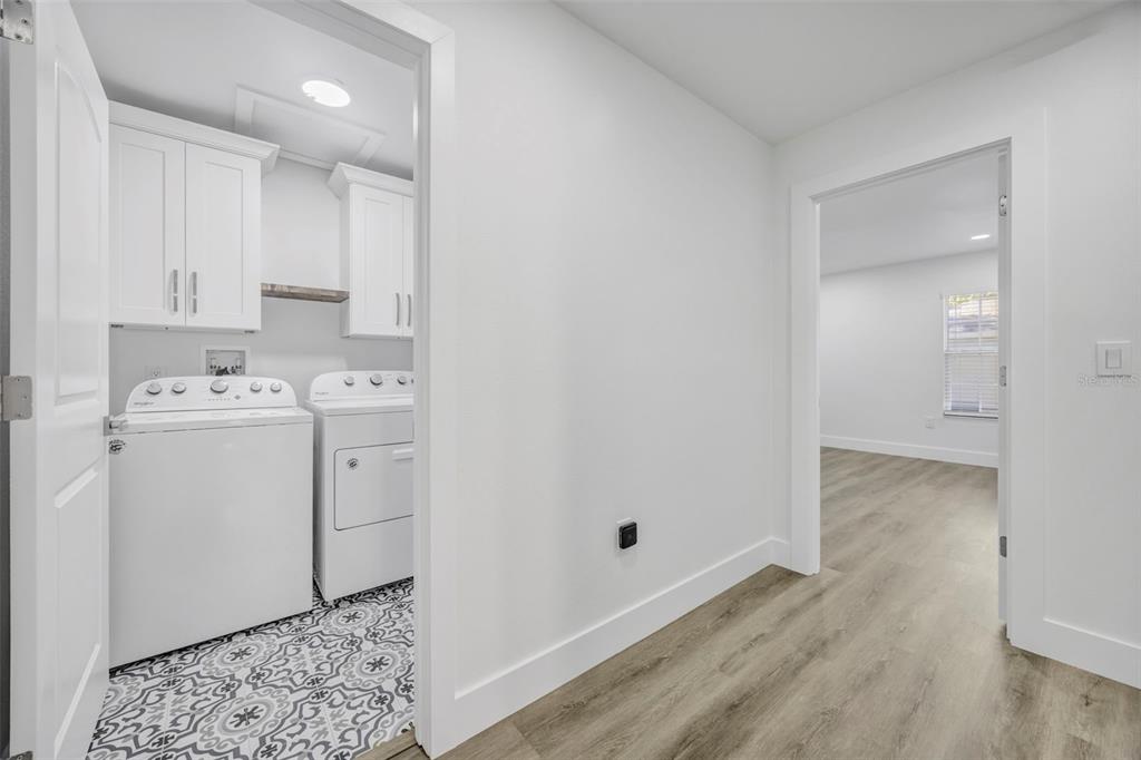 11728 Raintree Drive Temple Terrace, FL 33617 - Photo 23 of 41 a storage room with wooden floor washer and dryer