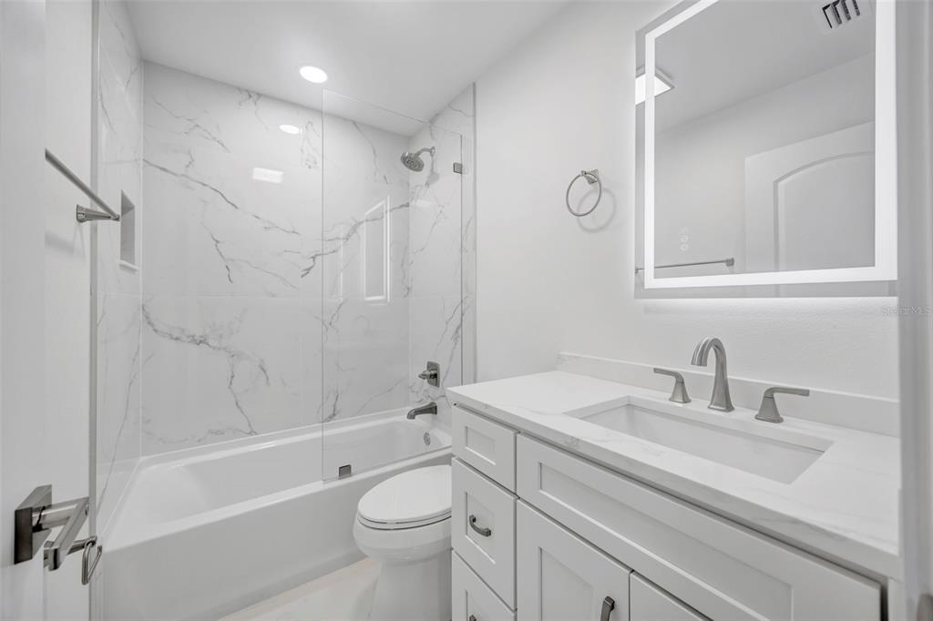 11728 Raintree Drive Temple Terrace, FL 33617 - Photo 29 of 41 a bathroom with a sink a toilet and shower